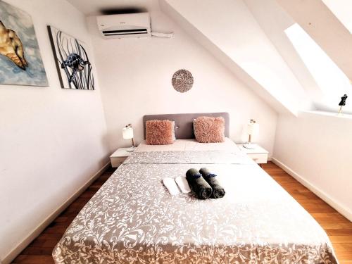 a bedroom with two beds in a attic at Bucharest Central EE Apartment in Bucharest