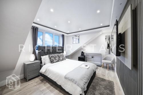 Ένα ή περισσότερα κρεβάτια σε δωμάτιο στο Hackney Suites - En-suite rooms & amenities