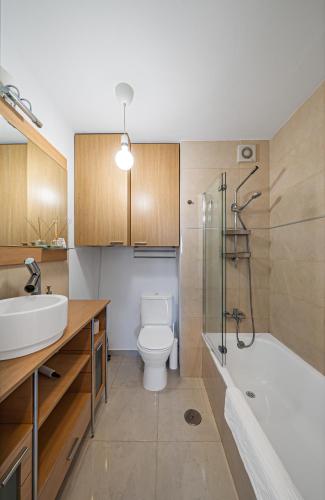a bathroom with a sink and a toilet and a shower at Pura Vida King-Size Bed Sea and Mountain view Apartment in Benalmádena