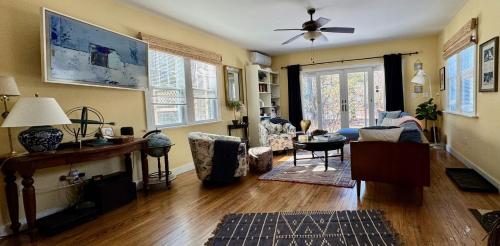 a living room with a couch and a table at 1890 CapeCod farmhouse:Charming, Private, Spacious in Saugerties