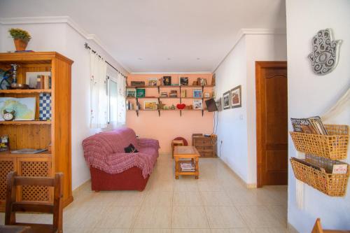 a living room with a couch and a chair at Natura Mediterranea Torremar atico 1 dorm naturista 430 in Playas de Vera