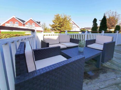 a patio with two chairs and a table at Ferienpark Scharmützelsee in Wendisch Rietz
