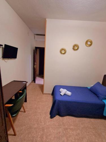Letto o letti in una camera di Hostal Doña María