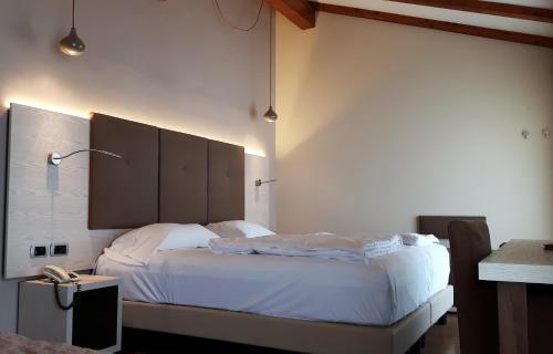 Postel nebo postele na pokoji v ubytování Hotel Galvani