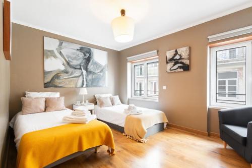 Postel nebo postele na pokoji v ubytování Exquisite Townhouse for up to 8 in Lisbon City Center