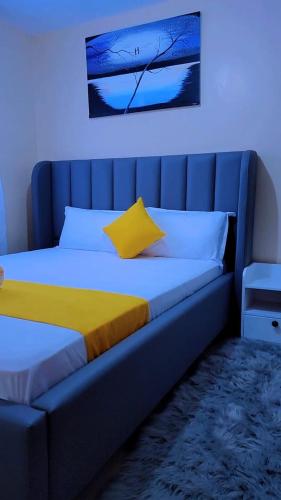 Postel nebo postele na pokoji v ubytování PureHaven Homes ruiru kamakis