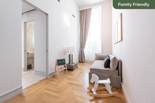 a living room with a couch and a table at Limehome Lecce Palazzo BN in Lecce
