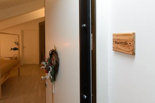 a door with a sign on it next to a room at Casa Vittoria in Agropoli