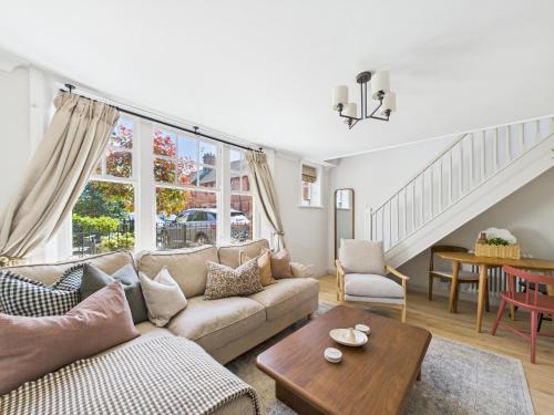 a living room with a couch and a table at Cosy Chester Cottage - Quaint Stay Sleeps 2-5 in Chester