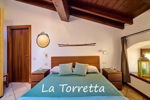 Posteľ alebo postele v izbe v ubytovaní Appartamento La Torretta