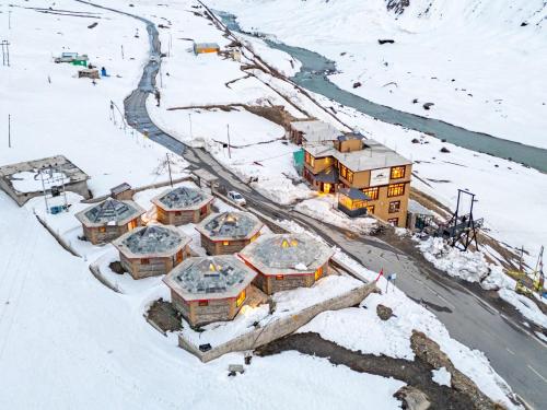 an aerial view of a building in the snow at Moustache Koksar Luxuria, Sissu in Khoksar