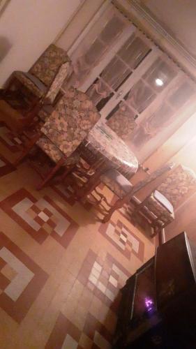 an overhead view of a table and chairs in a room at Le confort sans chichis, un cocon pour 1 à 6 voyageurs in Lapeyrouse