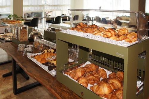 a bakery filled with lots of loaves of bread at Continental B&B City Hotel in Bibione