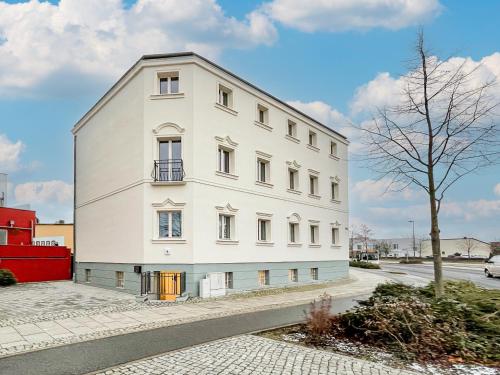 a white building on the side of a street at Westpromenade No 6 in Senftenberg