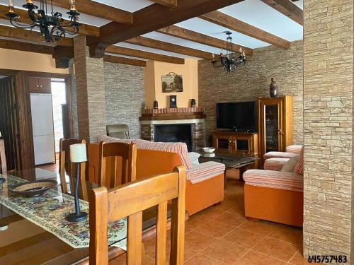 a living room with a couch and a table at La Golondrina in Cáñar