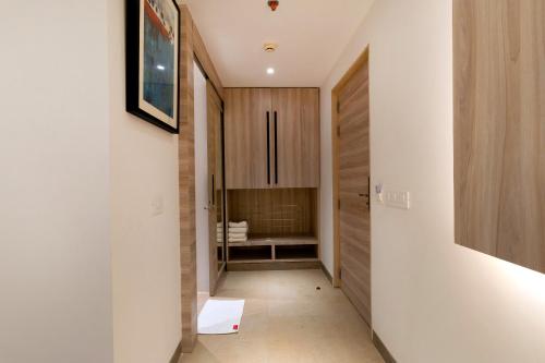 a hallway of a house with a door and a bathroom at The OPO Royal Free Airport Pick-Up in New Delhi