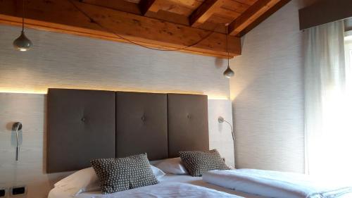 Postel nebo postele na pokoji v ubytování Hotel Galvani