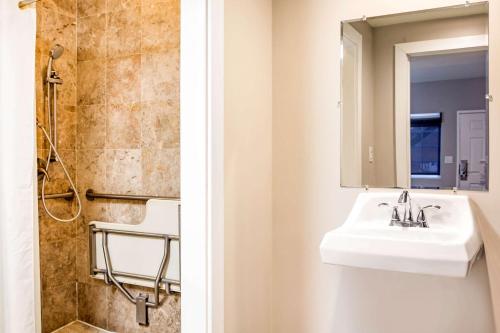a bathroom with a sink and a shower at Rodeway Inn near Melrose Ave in Los Angeles