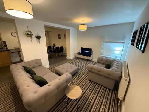 a living room with two couches and a television at ResiLets - Newsham Road -Large 2 BR Short Stay Apartment for Holidays Contractors Visitors in Blythe