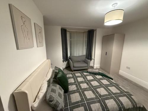 a living room with a couch and a chair at ResiLets - Newsham Road -Large 2 BR Short Stay Apartment for Holidays Contractors Visitors in Blythe