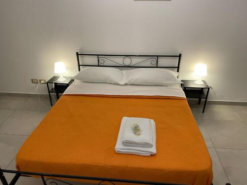 Postel nebo postele na pokoji v ubytování Fiordalisi home
