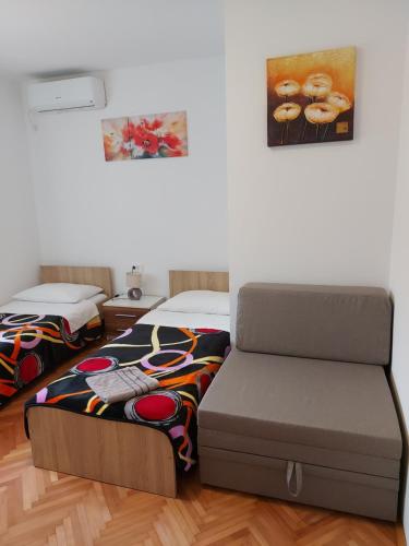 Katil atau katil-katil dalam bilik di Elena Rooms