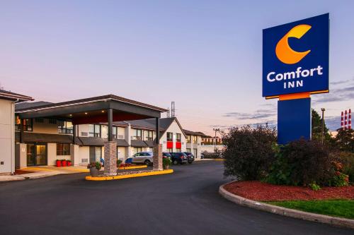 a sign for a comfort inn in a parking lot at Comfort Inn Dartmouth in Halifax