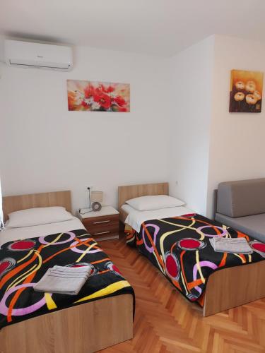 Katil atau katil-katil dalam bilik di Elena Rooms