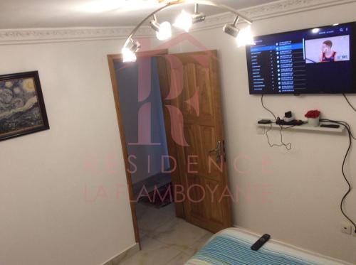 TV a/nebo společenská místnost v ubytování Residence La Flamboyante
