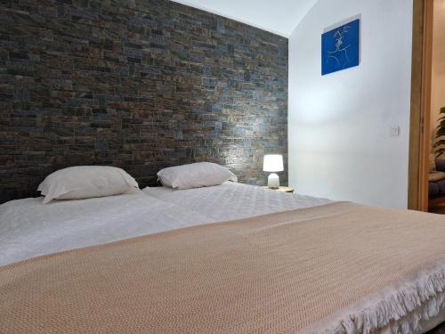 Ένα ή περισσότερα κρεβάτια σε δωμάτιο στο Casa do Barão