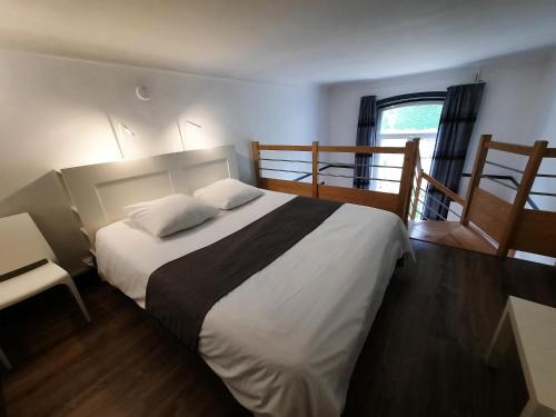 Postel nebo postele na pokoji v ubytování Pavillon Kalensa