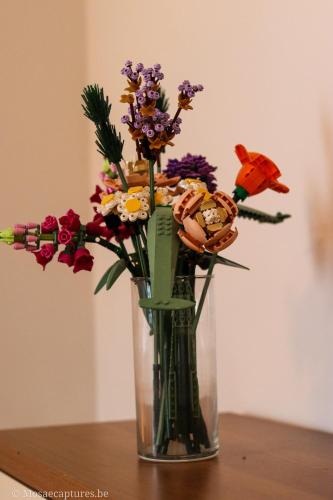 a vase filled with flowers sitting on a table at De Millenniumhoeve (Jean) in Riemst