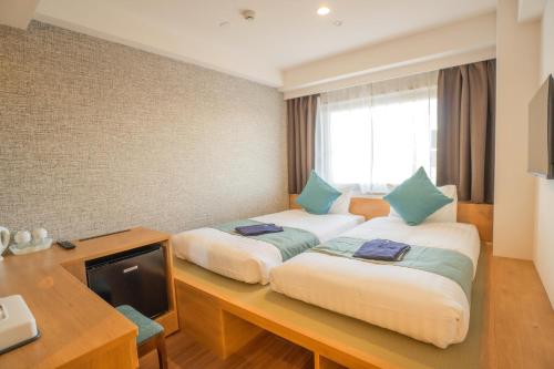 Кровать или кровати в номере Osaka Kansai Airport Hotel