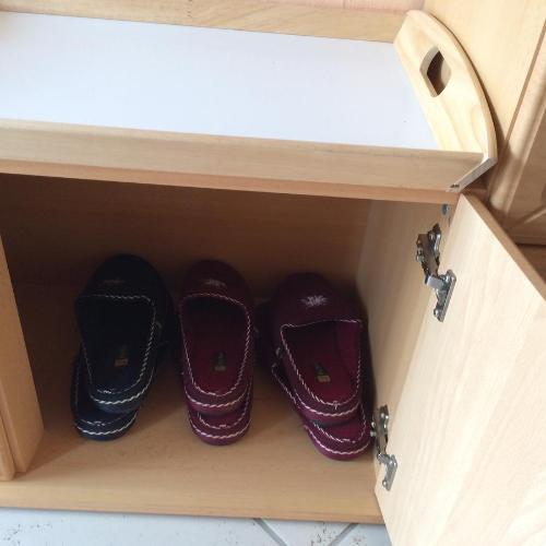 two pairs of shoes are inside of a drawer at Pension Hönel-Hof Bad Schandau in Bad Schandau