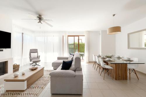 a living room with a couch and a table at Charming Villa Óbidos by LovelyStay in Casal do Narcizo