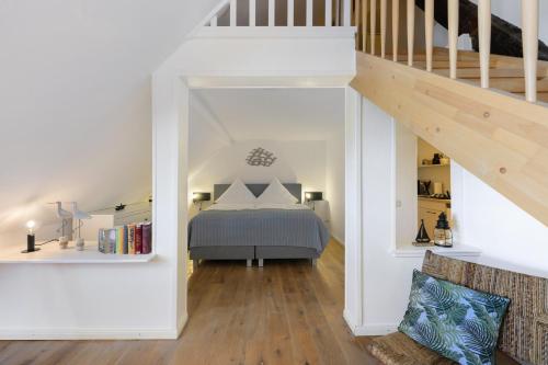 Ένα ή περισσότερα κρεβάτια σε δωμάτιο στο Leuchtturm