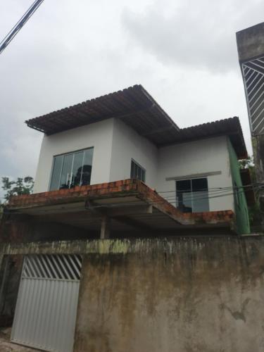 a house on top of a wall at COP 30 Casa com 3 quartos sendo 1 suite 4 banheiros sala cozinha e garagem in Ananindeua