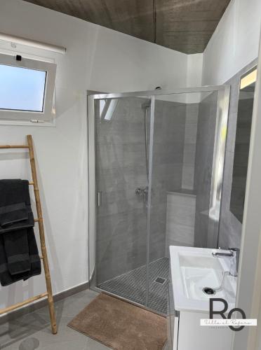 a bathroom with a shower and a sink at villa el rofero in Tinajo