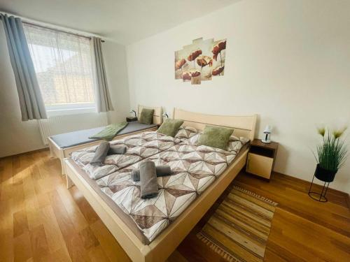 a bedroom with a large bed in a room at Bükk-Völgye Vendégház in Bogács