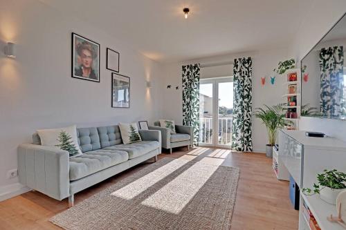a living room with a couch and two chairs at Sea Salt, Sagres Apartment in Sagres
