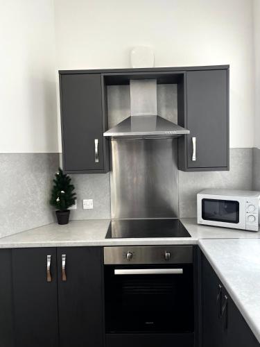 Η κουζίνα ή μικρή κουζίνα στο The Failsworth Collection - Stylish Apartments with Free Parking