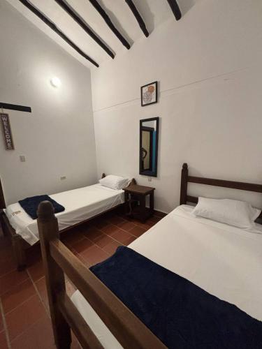 Letto o letti in una camera di Kazasha - Hotel Con Parqueadero Privado