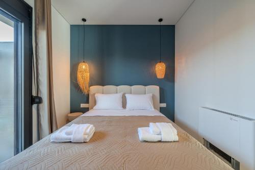Ένα ή περισσότερα κρεβάτια σε δωμάτιο στο Rosy Villas Collection