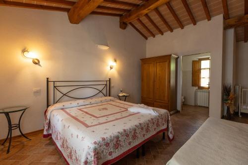 Postel nebo postele na pokoji v ubytování Agriturismo San Carlo