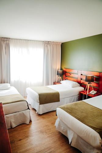 Postel nebo postele na pokoji v ubytování Hotel Limari