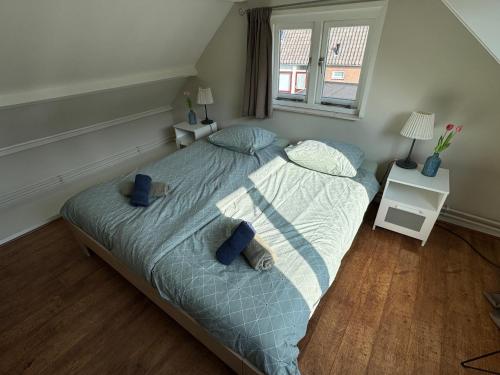 Ένα ή περισσότερα κρεβάτια σε δωμάτιο στο Vakantiewoning Zon, Zee & Duin - Egmond aan Zee