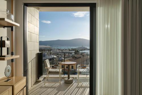 a balcony with a view of a city at SIRO Boka Place in Tivat