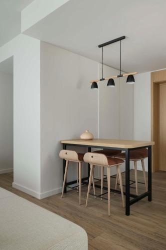 a dining room with a table and chairs at SIRO Boka Place in Tivat