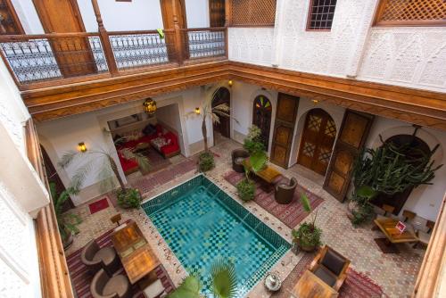 an overhead view of a swimming pool in a house at Riad Melhoun & Spa in Marrakech