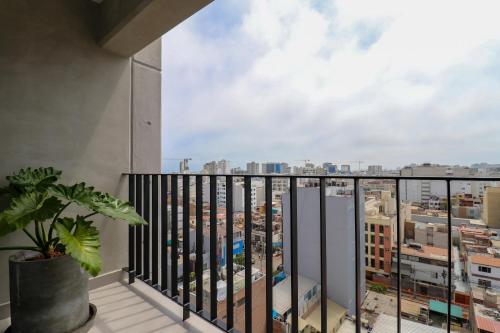 a balcony with a view of a city at Pod by Wynwood House in Lima